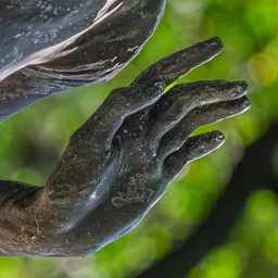 Close-up of the Spring statue's hand.
