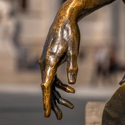 Close-up of Attila József's bronze hand.