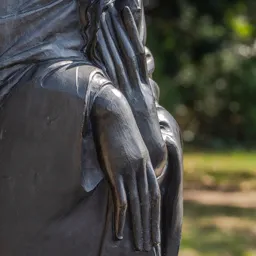 Close-up of the Buddha statue's hands.