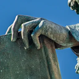 Close-up of János Arany's hand.