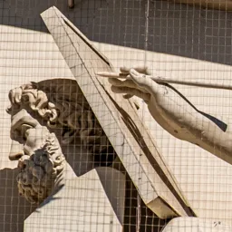 Close-up of the hand of the female figure representing History.
