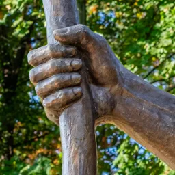 Close-up of Saint Christopher's hand.
