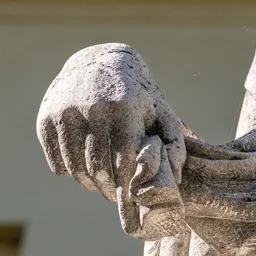 Close-up of the hand of the Peace figure.