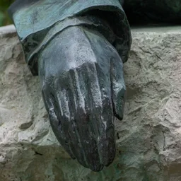 Close-up of Kosztolányi's hand.