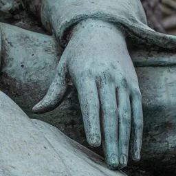 Close-up of the student's hand resting on an open book.
