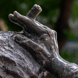 Close-up of Columbo's hand holding a cigar.