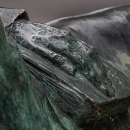 Close-up of Arthur Koestler's hand resting on a book.