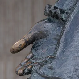 Close-up of Shakespeare's open right hand during a theatrical bow.