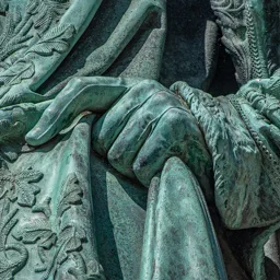 Close-up of Archduke Joseph's left hand gently holding his cloak.