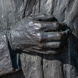 Close-up of Tamás Cseh's right hand resting over his heart.