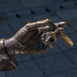 Close-up of Imre Kálmán's left hand holding a cigar.