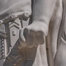 Close-up of Hungaria's right hand clenched beside her body.