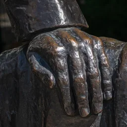 Close-up of Miklós Radnóti's left hand resting on his coat.