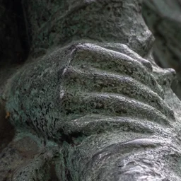 Close-up of a child's hand holding the mother's arm.