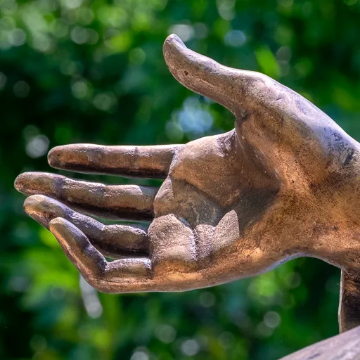 Close-up of the sculpted hand of Saint Barbara.